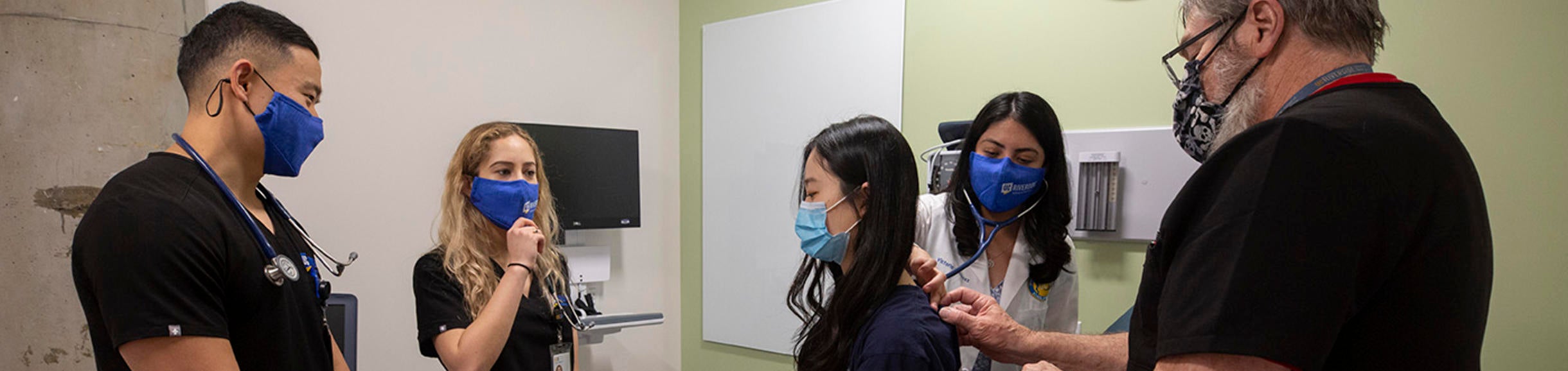 Students learning in mock exam room